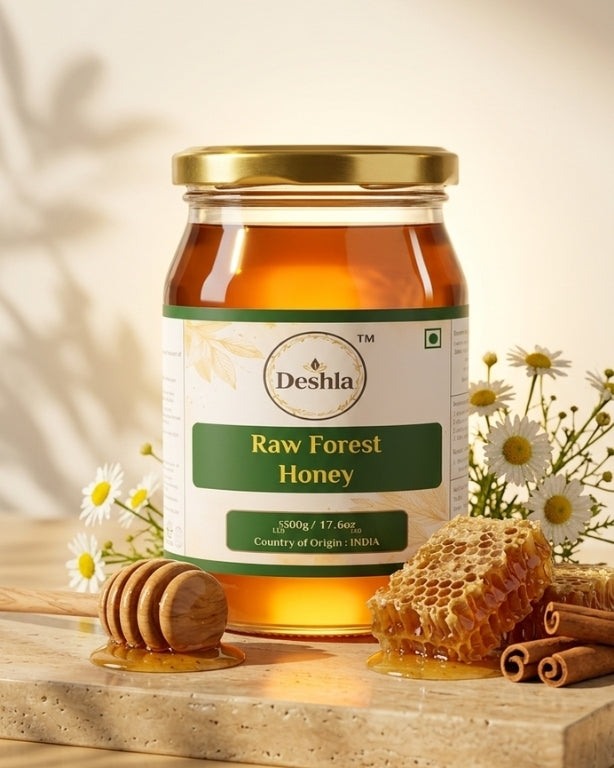 Jar of Deshla Raw Forest Honey with honeycomb and flowers on a wooden surface