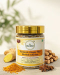 Deshla Turmeric Ginger Plus Herbal Infusion jar with turmeric root, cinnamon sticks, and star anise on a light background