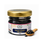 Jar of Royal Silajit Resin with a spoonful on a white background