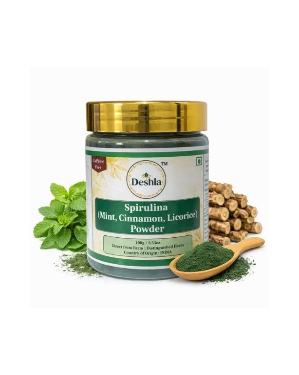 Jar of Desha Spirulina powder with mint leaves and a wooden spoon on a white background