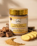 Jar of Deshla Golden Yellow Arjuna Bark Powder with ingredients on a beige background