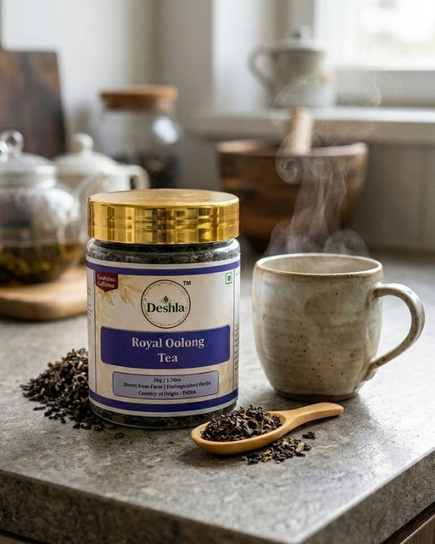 Deshla Royal Oolong Tea jar on a kitchen counter with a steaming mug and tea leaves.
